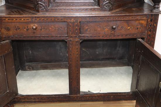 A 17th century marquetry inlaid oak court cabinet W.127cm